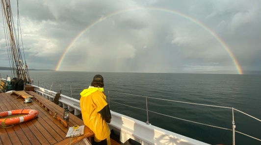A double rainbow crowning the ship